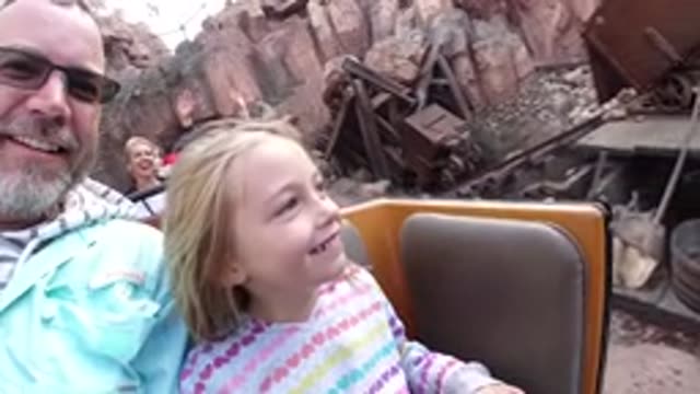 DISNEYLAND CALIFORNIA-2020: Father And His Little Daughter Have Fun On The