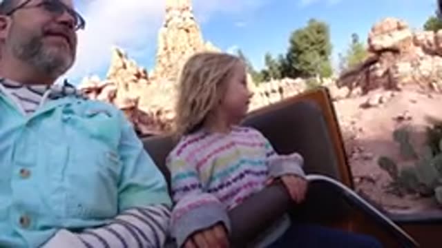 DISNEYLAND CALIFORNIA-2020: A Dad With His Daughter On A Roller Coaster In A