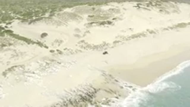 Aerial View Of RZR UTV On Sandy Beach