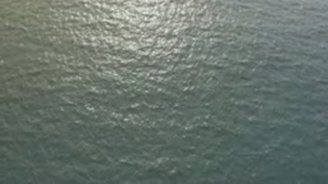 Aerial View Of Glistening Ocean Surface