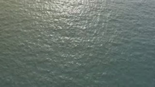 Aerial View Of Shimmering Ocean Surface