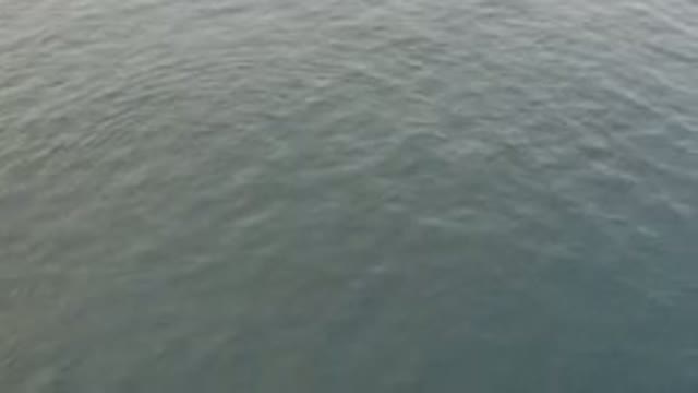 Aerial View Of Calm Grey Ocean Surface