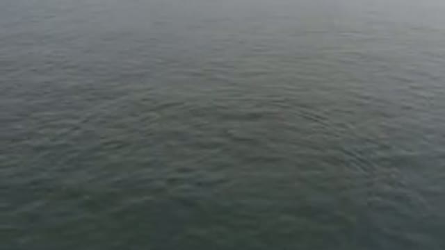 Aerial View Of Calm Grey Ocean Surface
