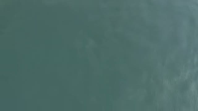 Aerial View Of Calm Teal Ocean Surface