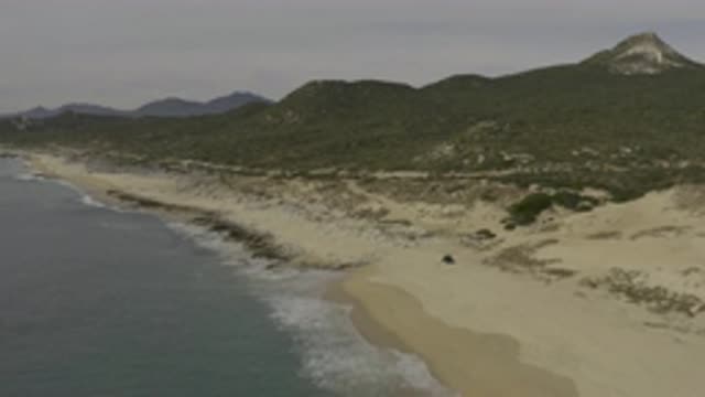 EAST CAPE BAJA CALIFORNIA SUR-2019: Flying Over A Sandy Beach Coastline With Mountains And Ocean