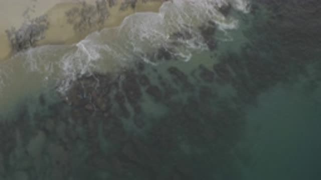 EAST CAPE BCS MEXICO-2019: Aerial View Of Waves Crashing Onto Beach On Sunny Day