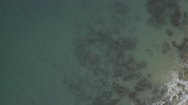 EAST CAPE BCS MEXICO-2019: Rocks Can Be Seen Through The Flat Sea Surface In A