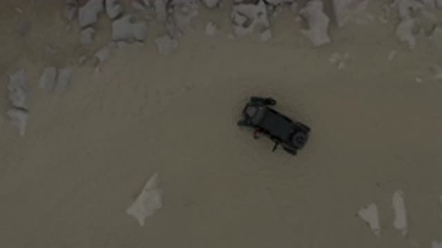 EAST CAPE BCS MEXICO-2019: View From Above Of A Man Getting Out Of A Car