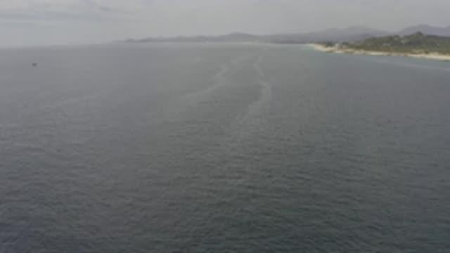 EAST CAPE BCS MEXICO-2019: A Coastline During The Day With Calm Water And A