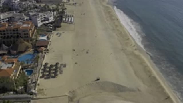 EAST CAPE BCS MEXICO-2019: Flying Over Beach Area Ocean To The Right Buildings