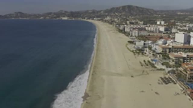 EAST CAPE BCS MEXICO-2019: Aerial View Of White Buildings, Tan Beach And Blue Ocean