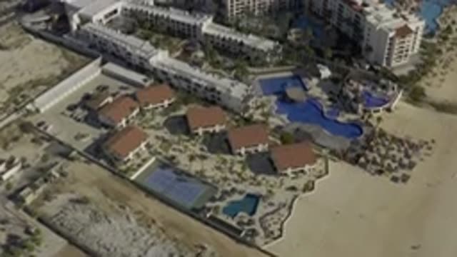 EAST CAPE BCS MEXICO-2019: View Of White Buildings And Blue Swimming Pools On A