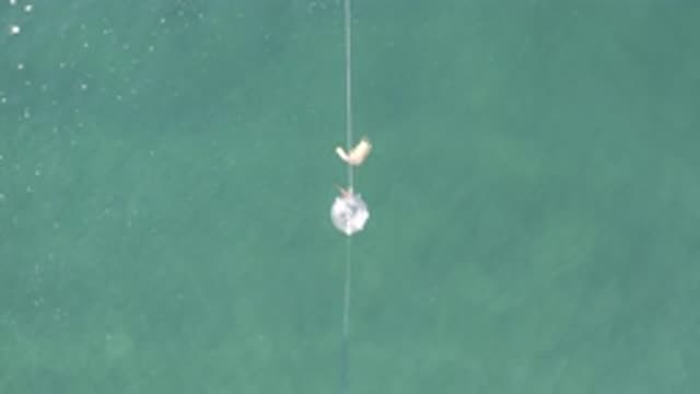 EAST CAPE BCS MEXICO-2019: White Object Bungee Jumping Over Crystal Blue Water