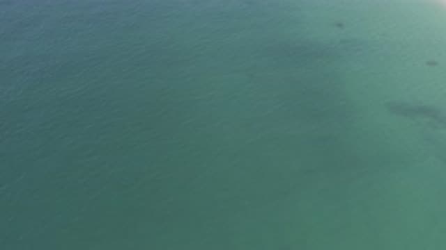 EAST CAPE BCS MEXICO-2019: Aerial View Of Water With Gray Shapes Below