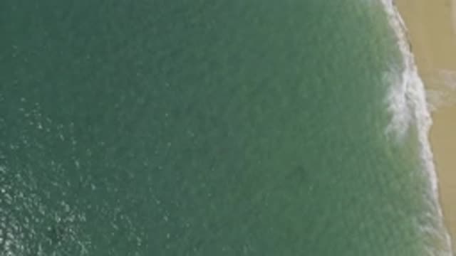 EAST CAPE BCS MEXICO-2019: An Aerial View Of A Sandy Beach As Waves Come Ashore