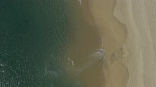 EAST CAPE BCS MEXICO-2019: Deserted Sand Beach With Waves Gently Lapping Shoreline