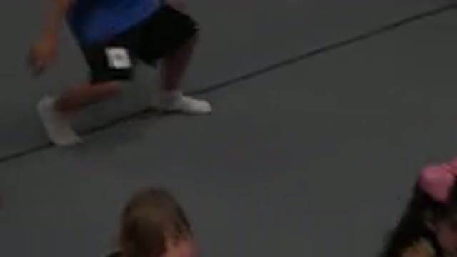 CABO SAN LUCAS MEXICO-2020: Girl Wearing Black Shirt Sits On Grey Floor Mat To