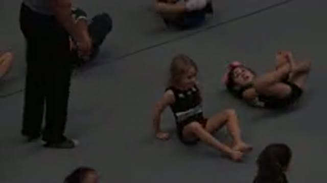 CABO SAN LUCAS MEXICO-2020: Kids Frog Legs Rolling On The Floor In Group Class