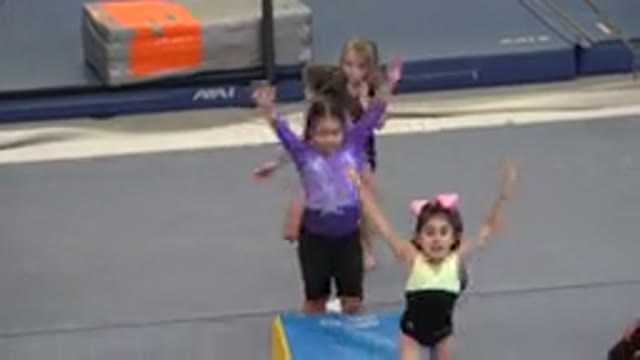 CABO SAN LUCAS MEXICO-2020: Young Girls In Leotards Practice Tumbling While A Coach Supervises