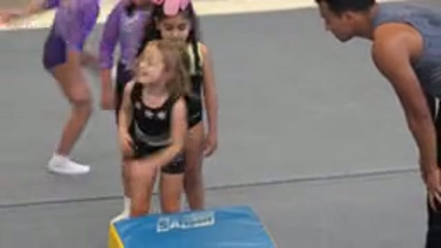 CABO SAN LUCAS MEXICO-2020: Coach Instructing Little Girl To Do A Backwards Stunt