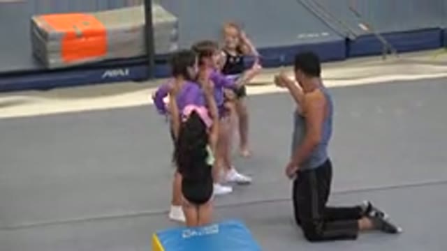 CABO SAN LUCAS MEXICO-2020: Young Girls Practicing Tumbling With A Coach In A