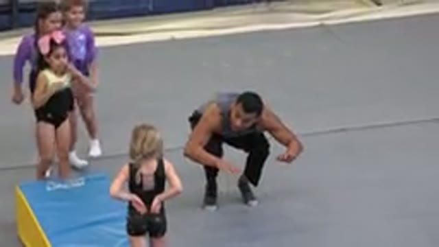 CABO SAN LUCAS MEXICO-2020: Adult Man Teaching Gymnastics To Four Girls Children
