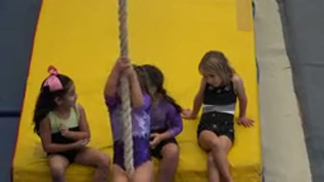 CABO SAN LUCAS MEXICO-2020: A Young Girl Climbs A Rope While Other Girls Watch