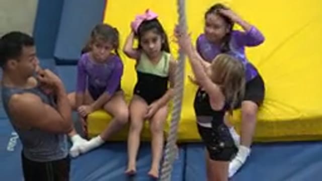 CABO SAN LUCAS MEXICO-2020: Some Little Girls Are Doing Exercise With Their Mentor