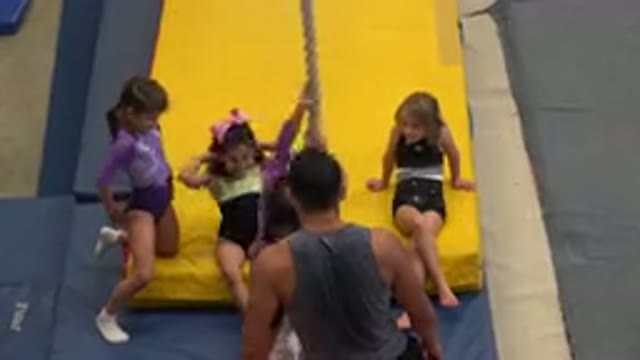 CABO SAN LUCAS MEXICO-2020: A Young Gymnast Attempting To Climb A Rope With Her