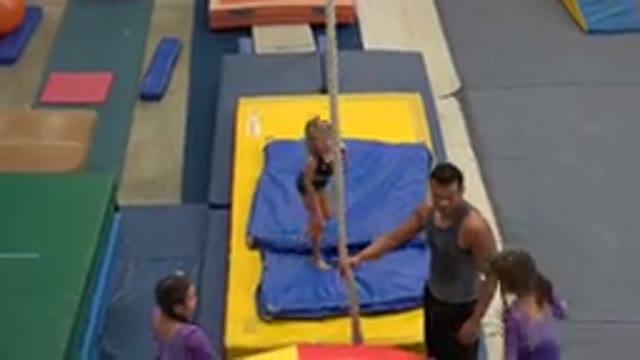 CABO SAN LUCAS MEXICO-2020: A Little Girl In Gymnastics Learns How To Swing From