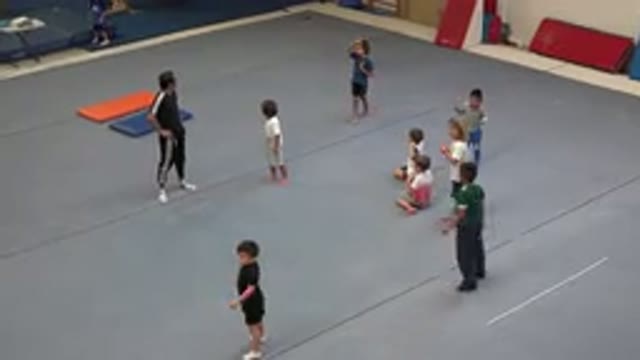 CABO SAN LUCAS MEXICO-2020: Coach Observing The Children Getting Warmed Up In