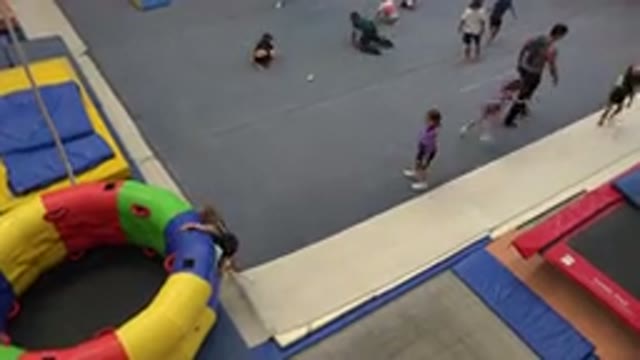 CABO SAN LUCAS MEXICO-2020: Two Kids Running Across Grey Floor Mat In Indoor