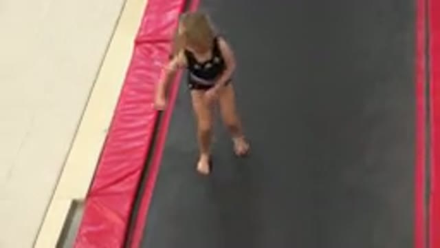 CABO SAN LUCAS MEXICO-2020: Little Girl Gymnast Excitedly Bounces On Trampoline