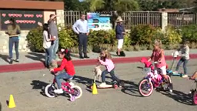 CABO SAN LUCAS MEXICO-2020: Kids Playing With Bicycle Near A Park Accompanied By Parents