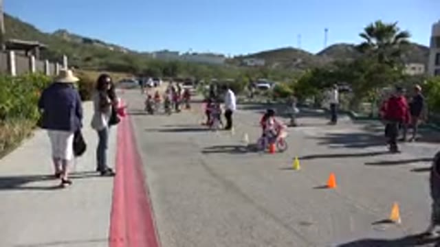 CABO SAN LUCAS MEXICO-2020: Kids Playing Cycling Game With People Watching