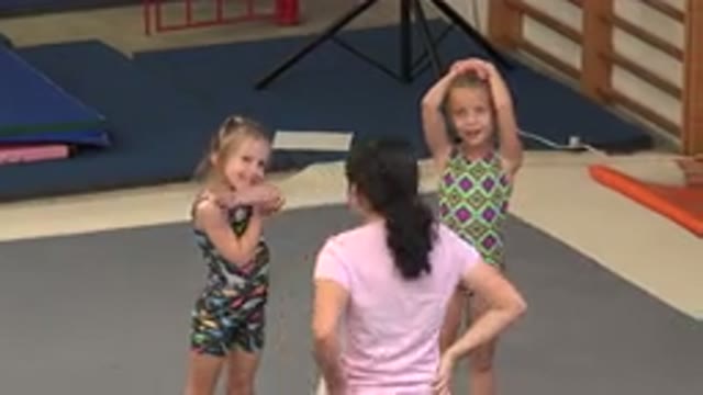 CABO SAN LUCAS MEXICO-2020: Little Girls Doing Gymnastics With Their Teacher