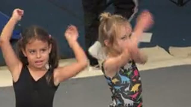 CABO SAN LUCAS MEXICO-2020: Two Cute Little Girls Waving Their Arms In What