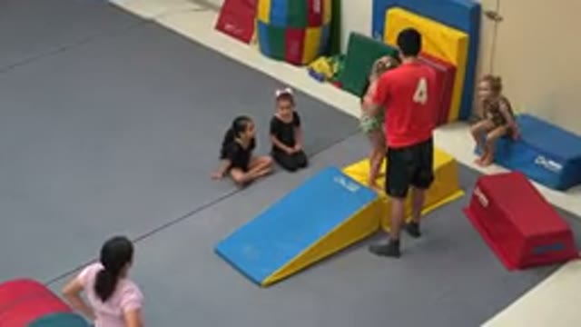 CABO SAN LUCAS MEXICO-2020: Male Gymnastics Instructor Shows Student How To Flip