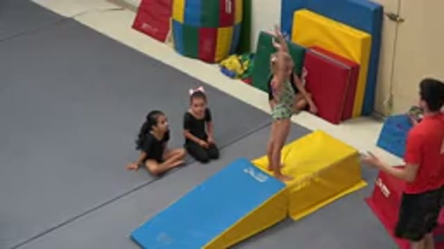 CABO SAN LUCAS MEXICO-2020: Young Girl on Elevated Gym Mat Takes Instruction