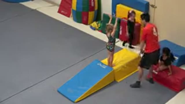 CABO SAN LUCAS MEXICO-2020: A Teenager Boy Helping A Little Girl With Tumbling