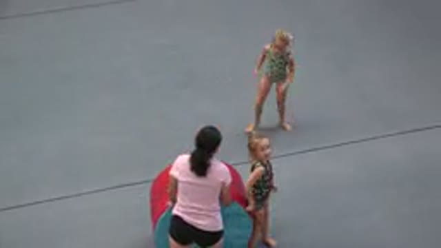 CABO SAN LUCAS MEXICO-2020: A Lady Helping Two Girl Children Practice Acrobatics
