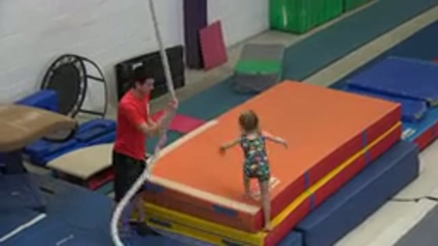 CABO SAN LUCAS MEXICO-2020: Little Girl Tightly Holds A Rope And Swings Herself