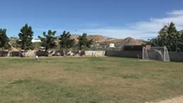 LOS CABOS MEXICO-2019: Kids Running Across A Field Together