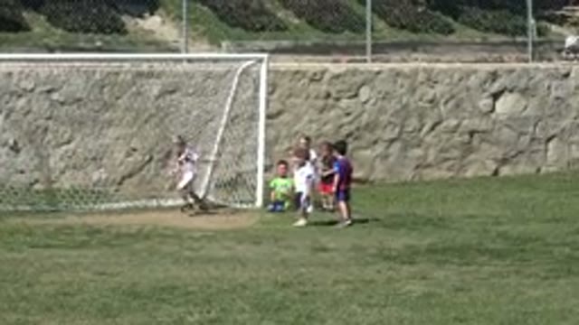 LOS CABOS MEXICO-2019: Parent Recording Child Playing Soccer on Field
