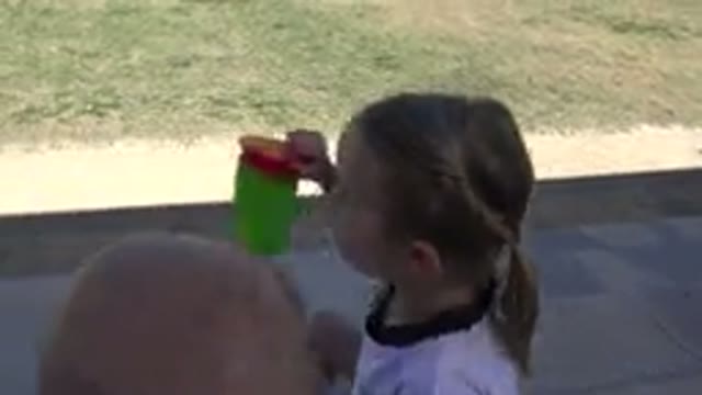 LOS CABOS MEXICO-2019: Tired Little Girl Drinks Water