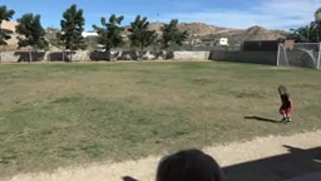 LOS CABOS MEXICO-2019: Empty Soccer Field With Two Young Children Running Around