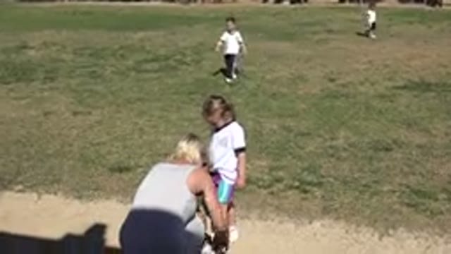 LOS CABOS MEXICO-2019: A Mother Tying Her Daughter Shoelaces In The Park