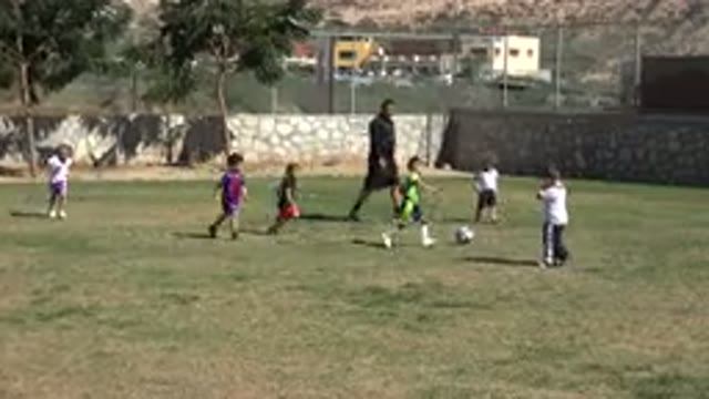 LOS CABOS MEXICO-2019: Children Playing Football And One Of Them Is About To Score