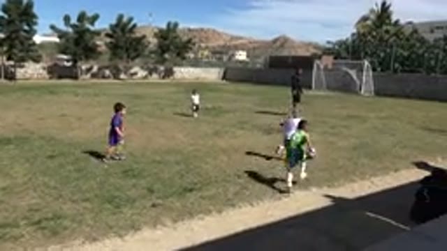 LOS CABOS MEXICO-2019: Kids Play Soccer On Soccer Field During Sunny Day With