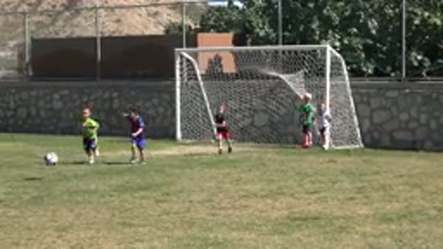 LOS CABOS MEXICO-2019: Kids Playing Football Under The Assistance of A Coach